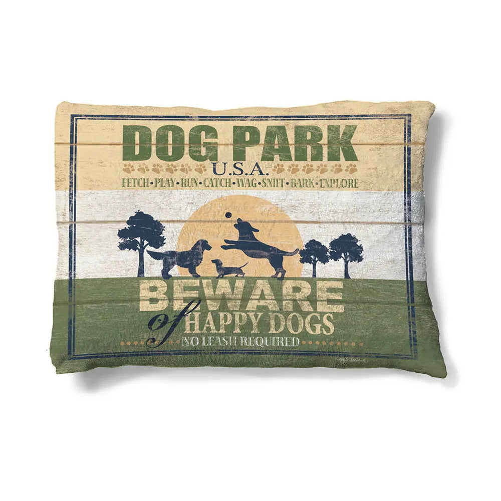 Dog Park 30" x 40" Fleece Dog Bed features dogs in silhouette playing along a field at sunset.