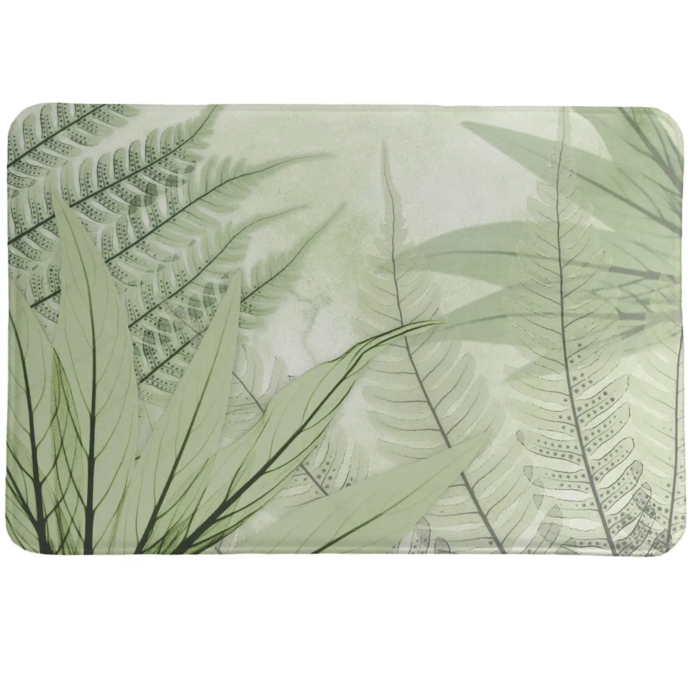 Layered Ferns Memory Foam Rug showcases a calming, nature-inspired design of layered ferns, created by a unique technique using an x-ray machine. 