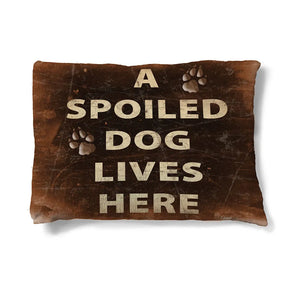 Spoiled Dog 30" x 40" Fleece Dog Bed features the heading amongst paw prints and is set on a rich, brown background.
