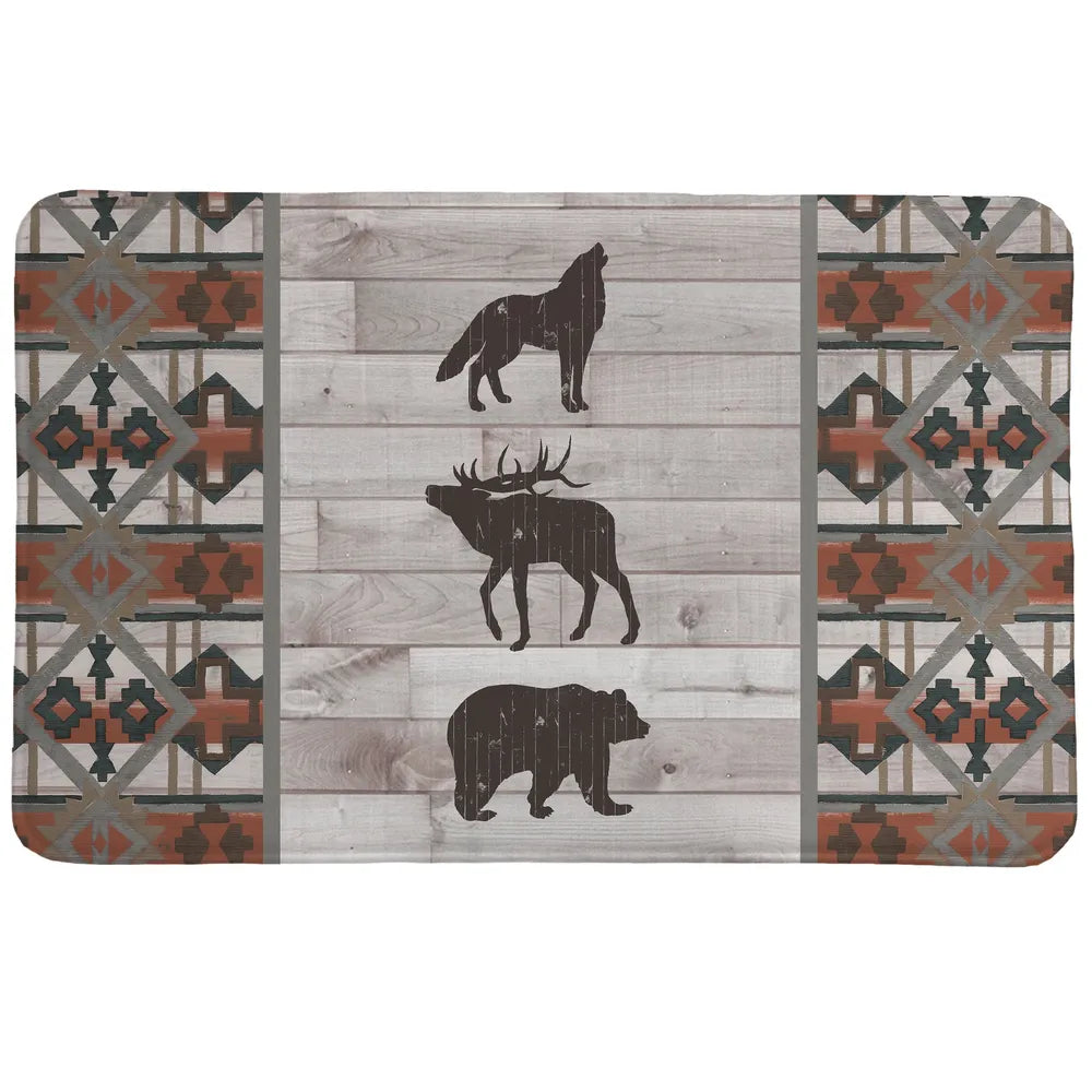 Southwest Lodge Memory Foam Rug features a southwestern pattern and wild animal icons set on a gray wooden planked background with terra cotta colored accents.